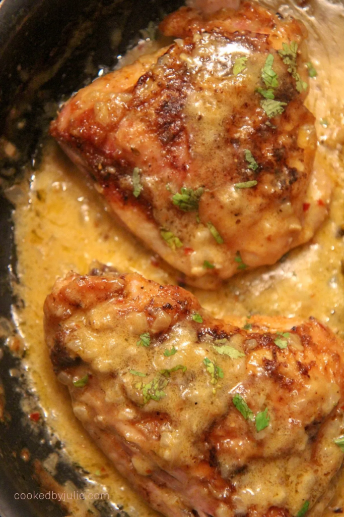 Creamy Smothered Chicken Thighs - Cooked by Julie