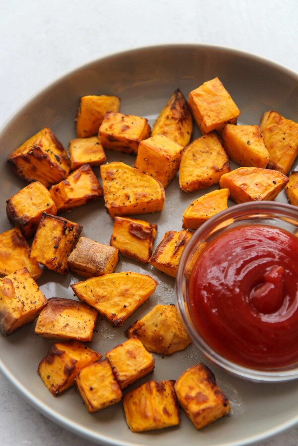 air fryer sweet potatoes with a side of ketchup.