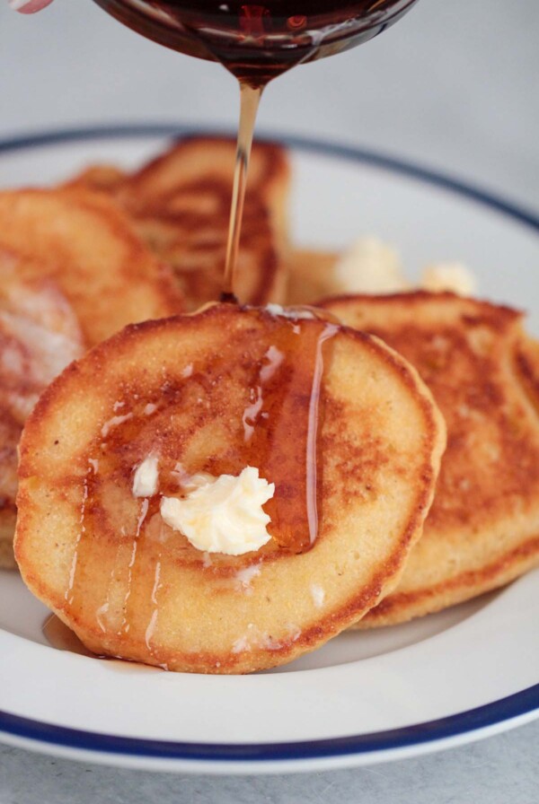 hoe cakes with butter and syrup up close.