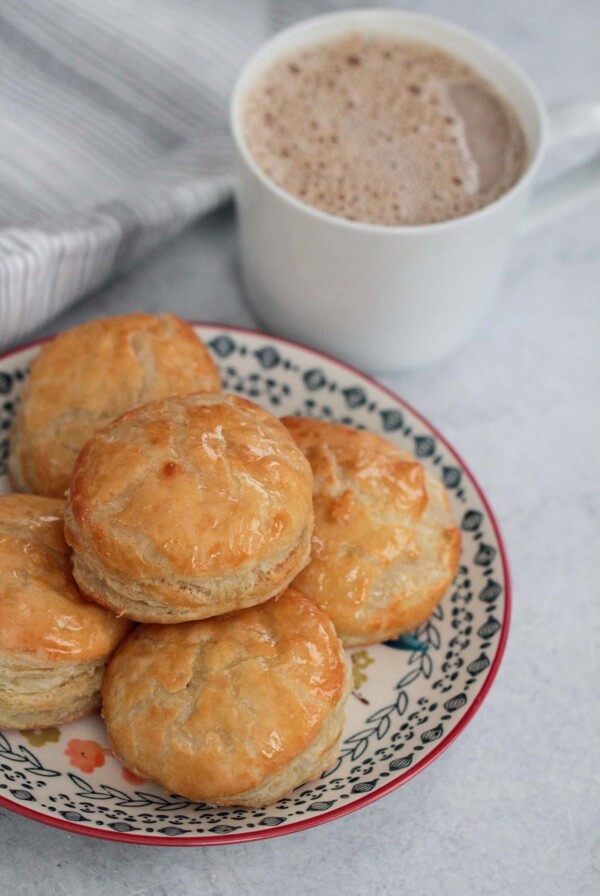 pastelitos de carne with a cup of coffee.