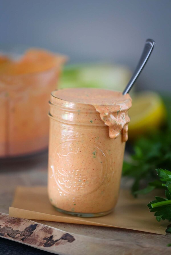 remoulade sauce in a mason jar with a spoon.