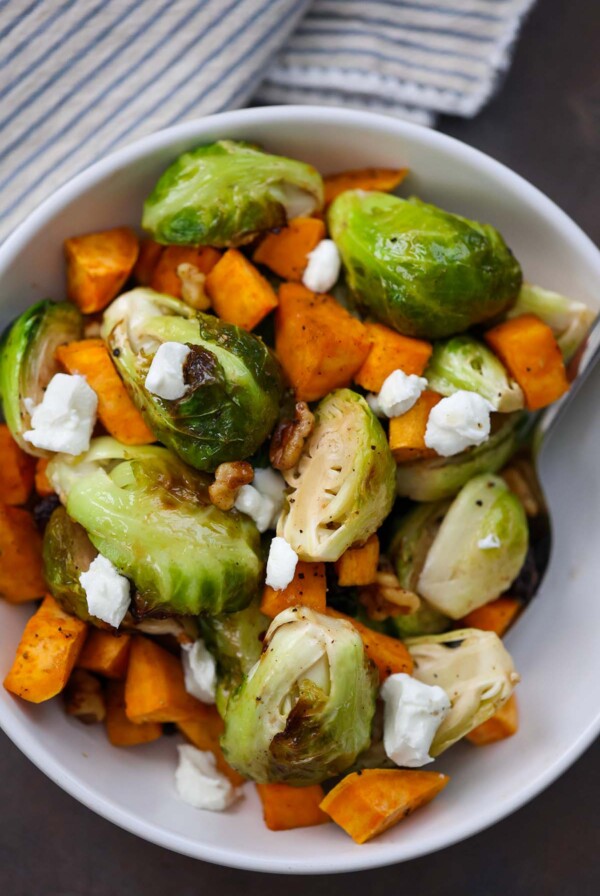 roasted brussel sprouts and sweet potatoes with goat cheese on top.