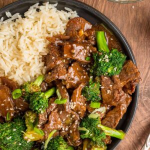 beef and broccoli with white rice on the side.