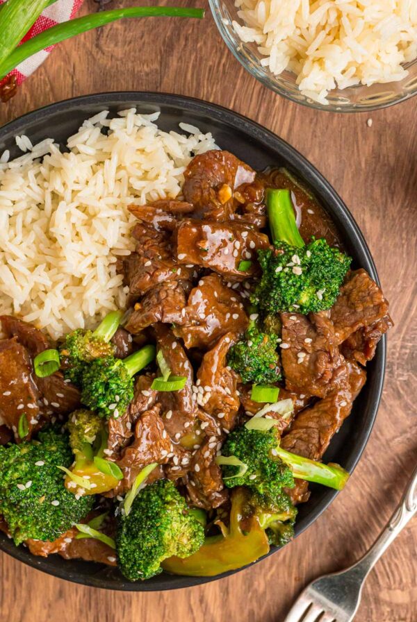 beef and broccoli with white rice on the side.
