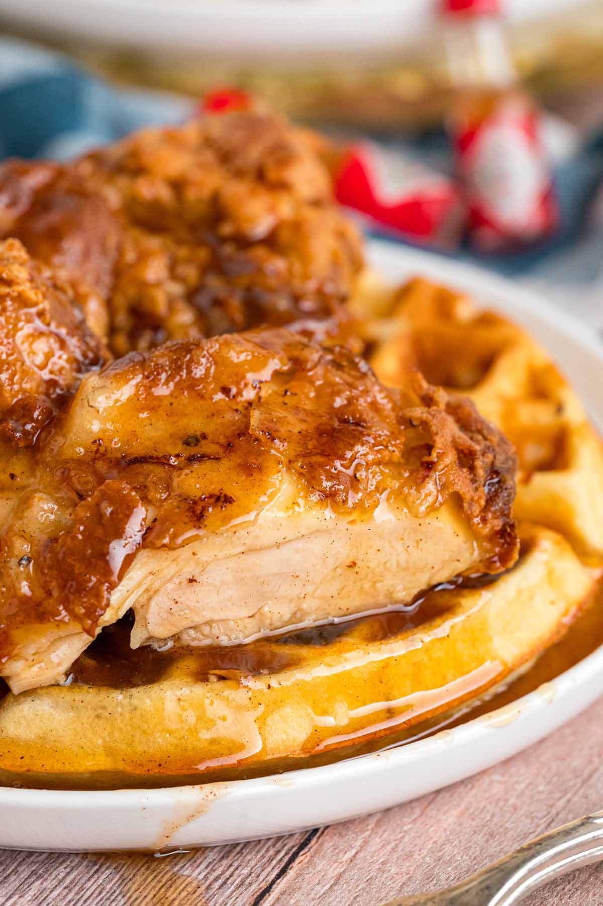 chicken and waffles with syrup up close. 